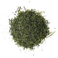 Dried Saemidori sencha leaves arranged in a small heap on a white background